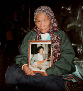 Sonam Dekyi with photo of her son