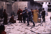 Peter Gold debating with monks in Tibet
